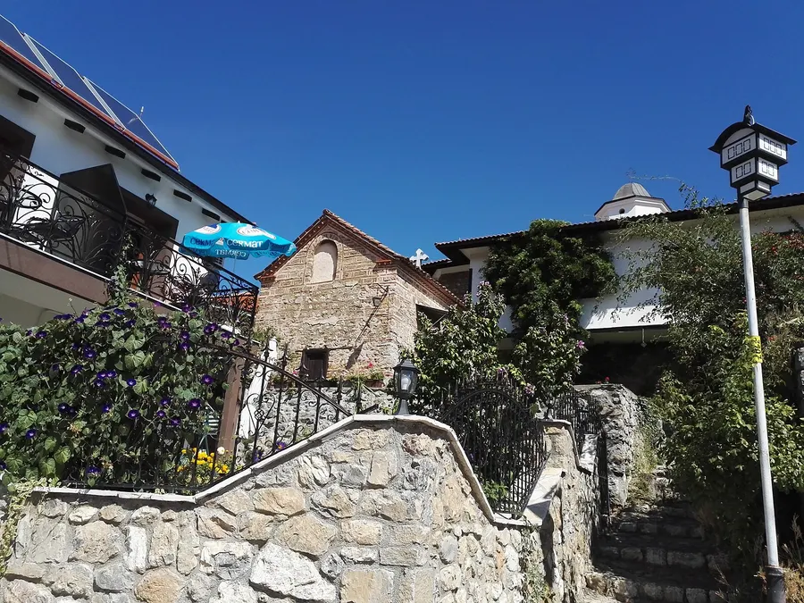 Stone steps and whitewashed houses on an old street in Ohrid
